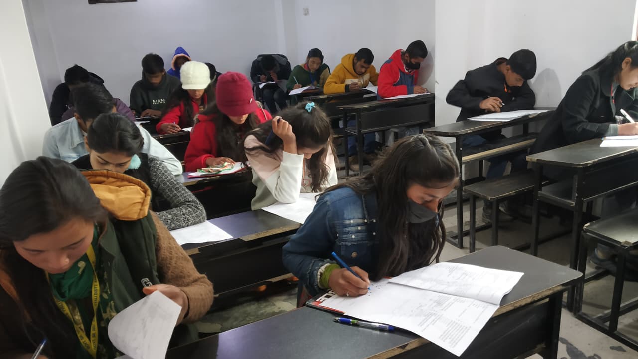 Students writing in a classroom